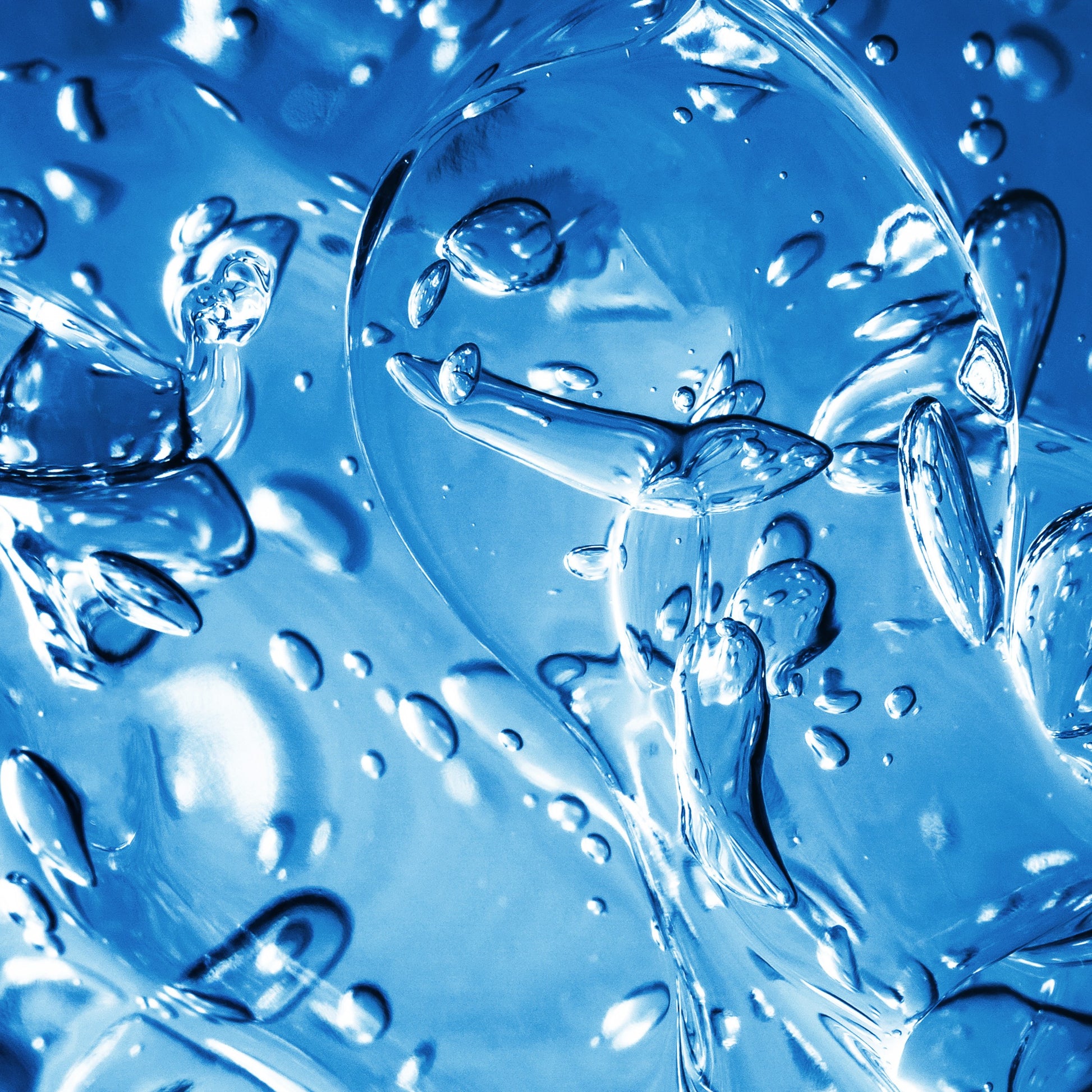 <Blue close up of the fizzy bubbles swirling in water as a tablet dissolves. Credit> AdobeStock_260973562