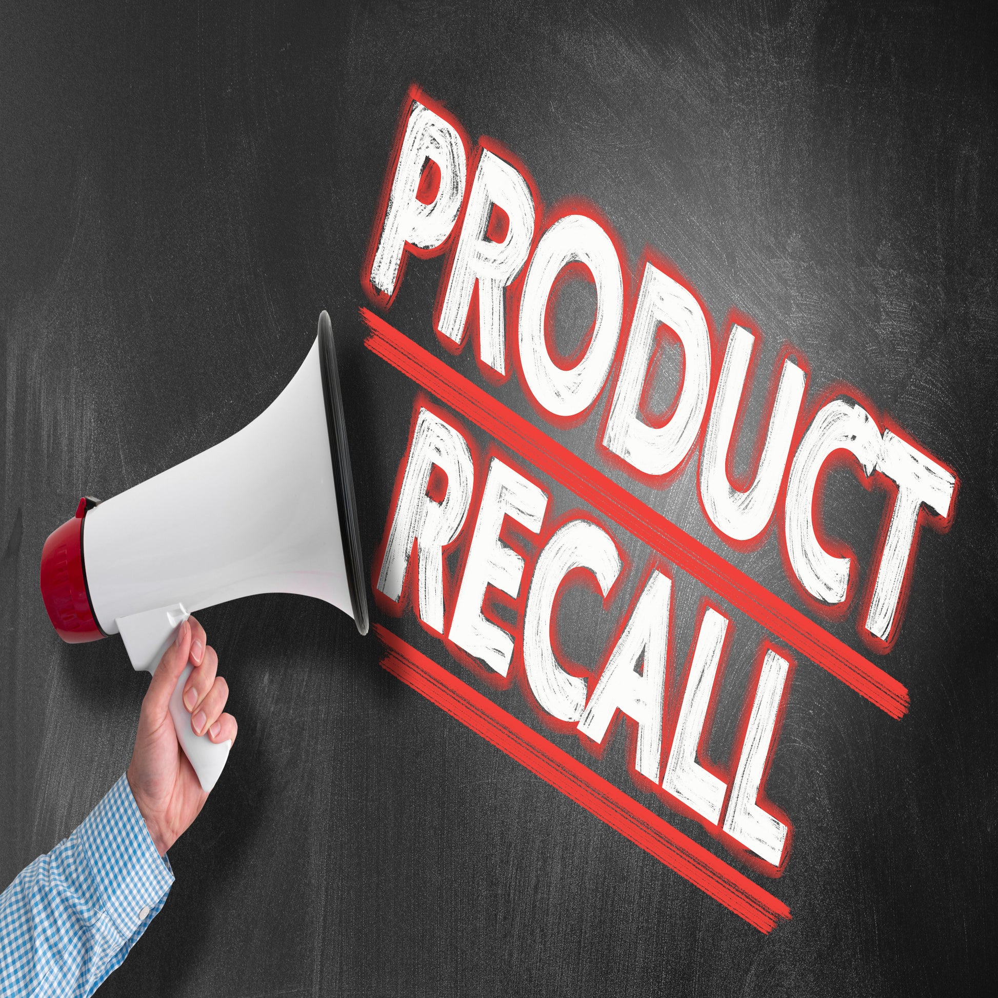 <Man's arm holding a red and white megaphone with the words Product Recall written in white and bordered and underlined in red coming out of it. Credit> AdobeStock_270560311