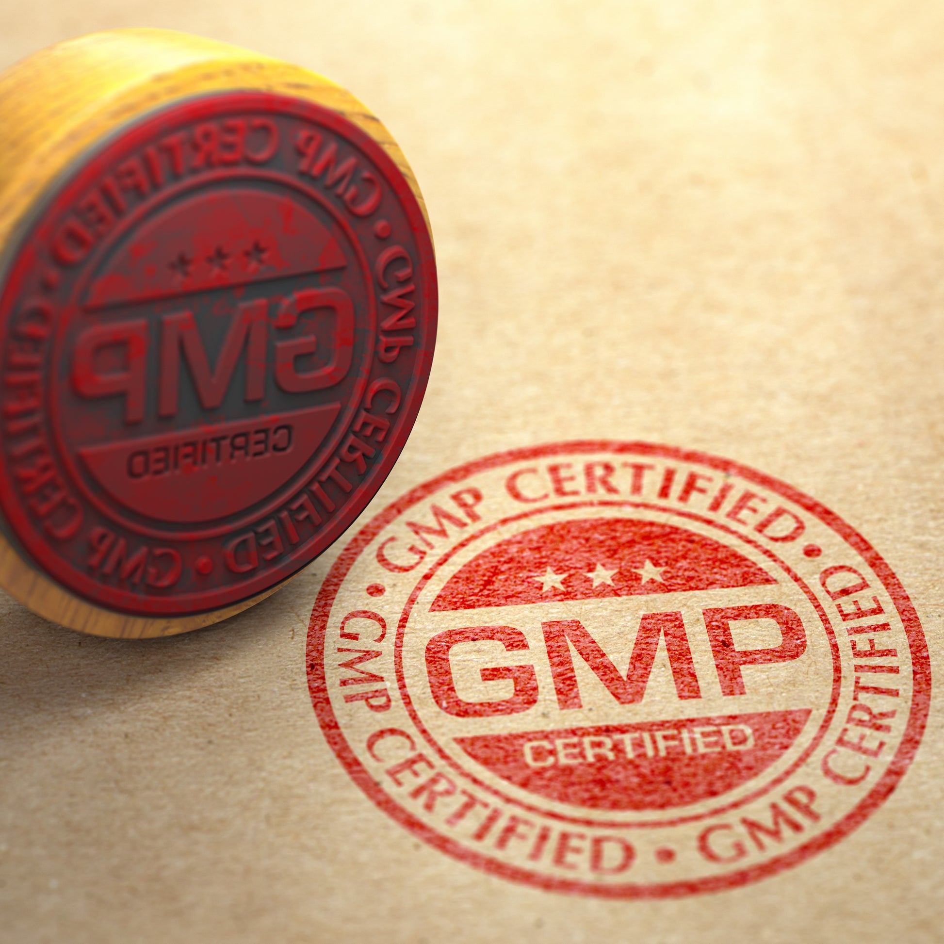 <Round GMP Certified logo stamped on a brown envelope in red ink with the stamp lying next to it. Credit> AdobeStock_413551778