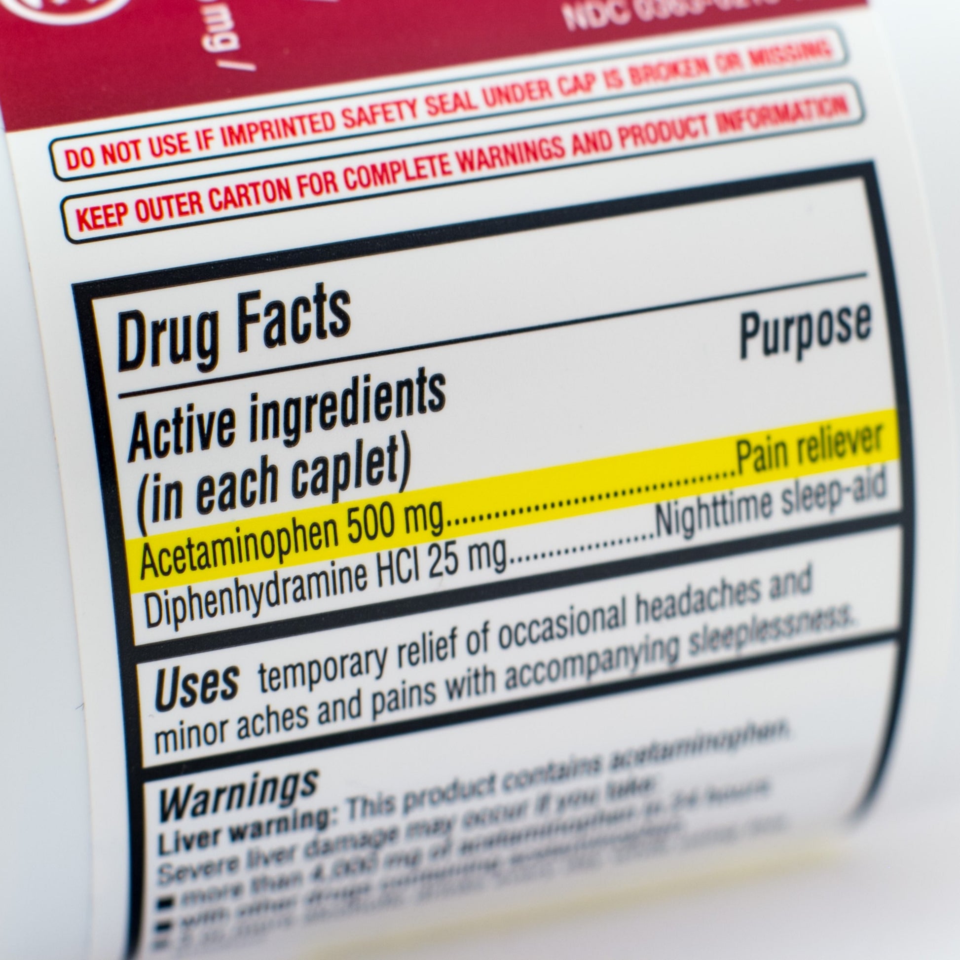 <Drugs facts label on a white bottle being inspected for claims and active ingredeint Acetaminophen vresus production and laboratory records. Credit> 53889861 © Kevin Giszewski | Dreamstime.com